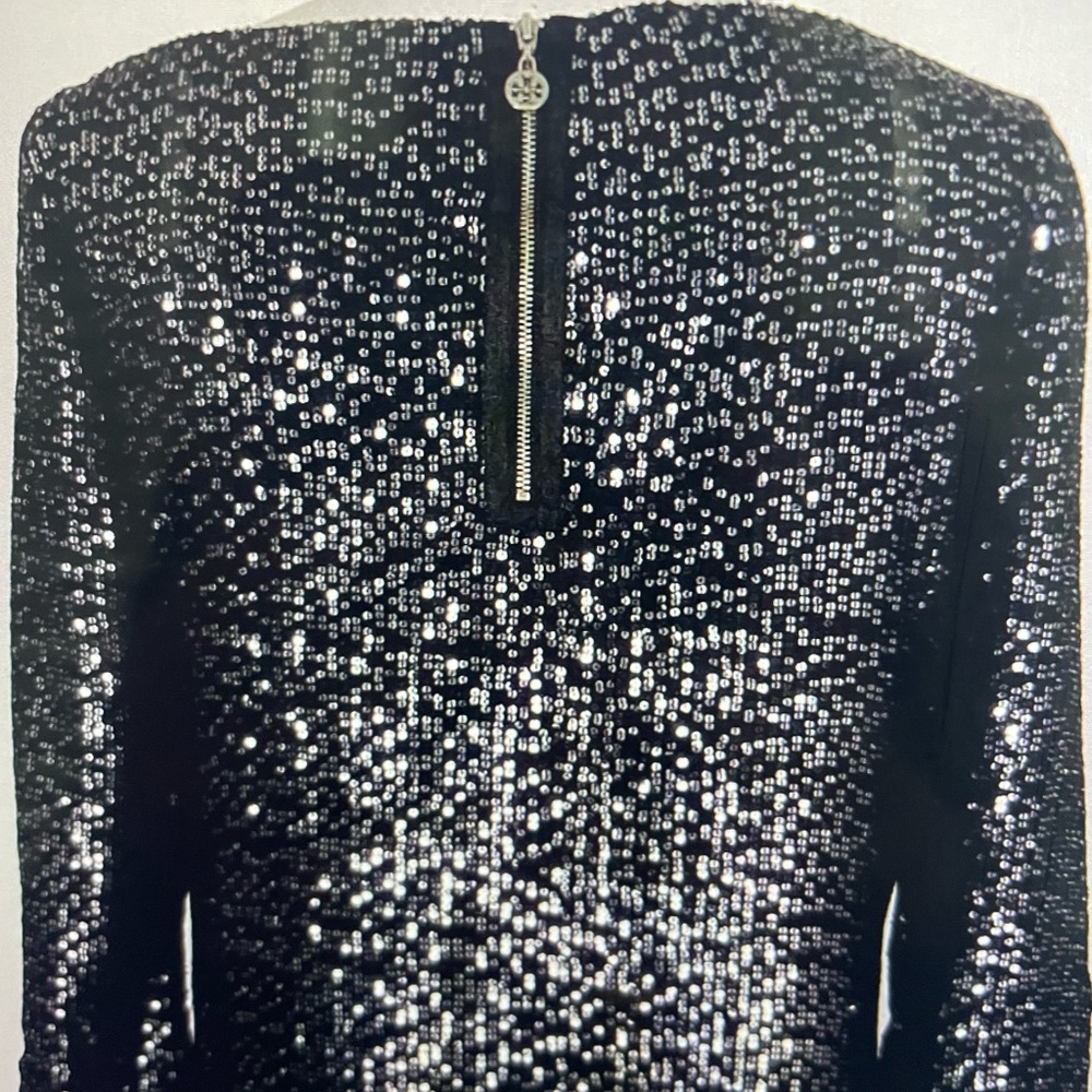 Tory Burch black shimmering sequin top. Boat neckline with 3/4 sleeves. Size 10